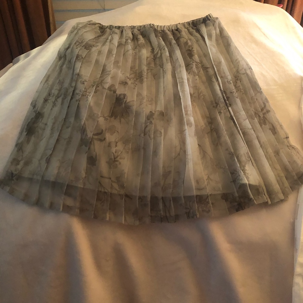 Pleated green flowered skirt